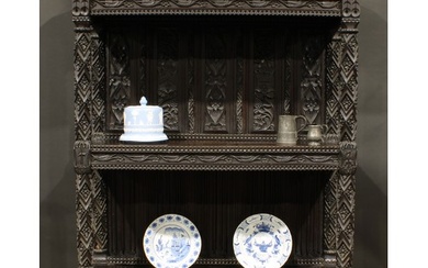 A 19th century oak buffet or cup-board, outswept cornice abo...