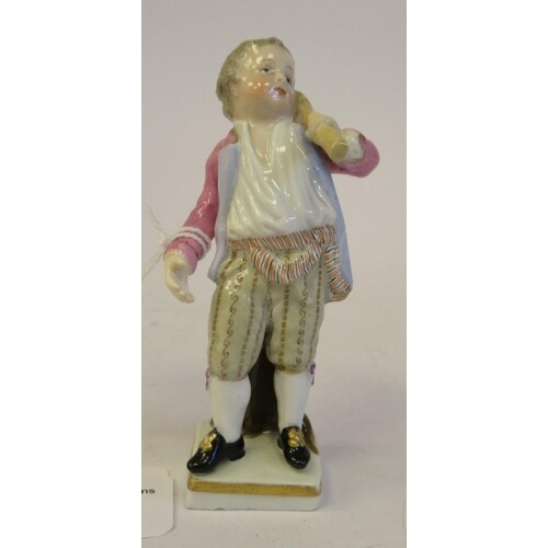 A 19th/20thC Meissen porcelain figure, a boy wearing knee br...