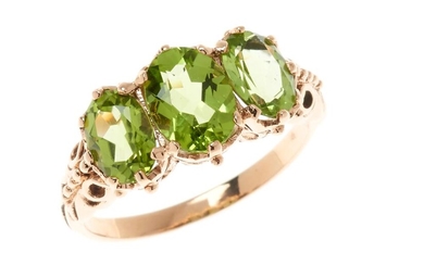 A 9CT GOLD VICTORIAN STYLE PERIDOT RING; set with 3 oval cut peridots in rose gold, size O, wt. 3.25g.