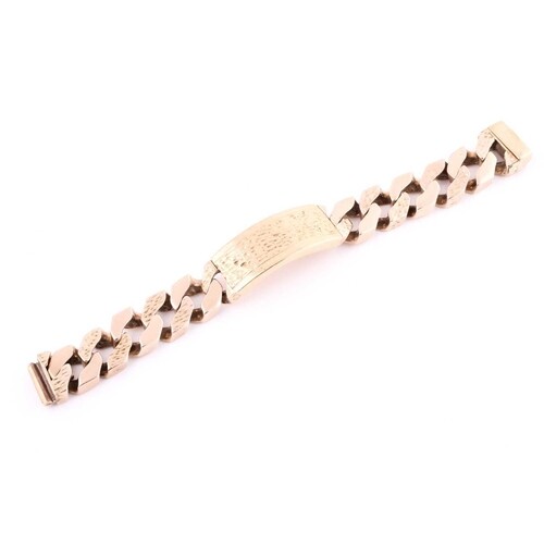 A 9ct yellow gold heavy curb link ID bracelet, with tongue a...