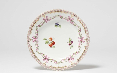 A Berlin KPM porcelain dessert plate from a service with fruit and rose garlands