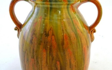 A Brannam of Barnstaple twin handled Barum ware vase