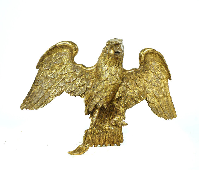 A CARVED GILT-WOOD MODEL OF AN EAGLE