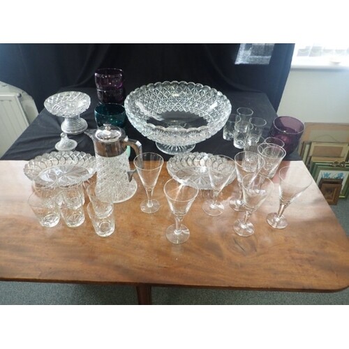 A COLLECTION OF GLASSWARE including a large cut glass centre...