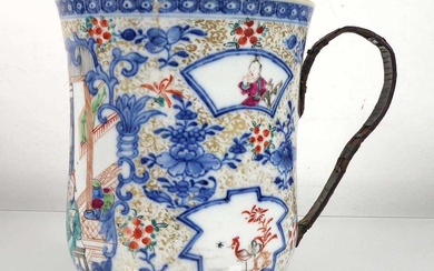 A Chinese Export mug of oversized proportions decorated with figures...