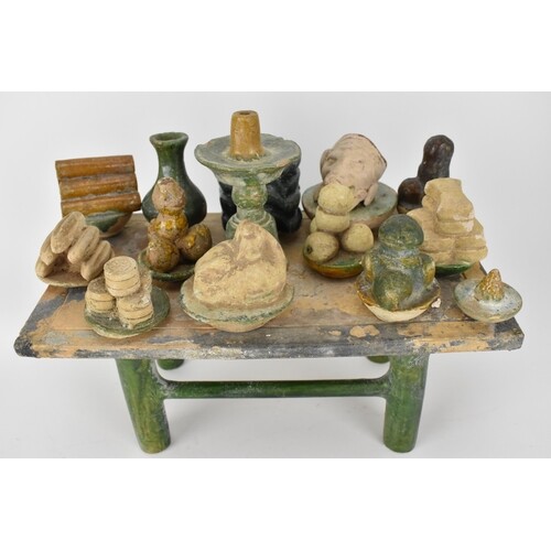 A Chinese Ming dynasty glazed pottery model tomb table and f...