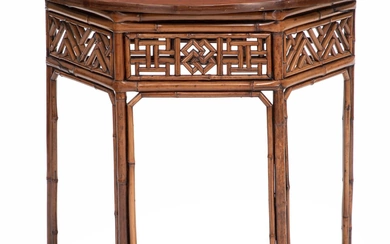 A Chinese bamboo and red-lacquer console table. Last half of the 19th...