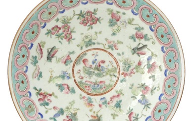 A Chinese ernamelled porcelain dish painted with flowers and fruits, rim with...