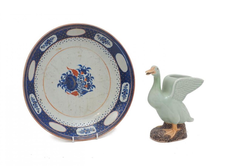 A Chinese export porcelain dish, 19th century, with central blue chrysanthemum design, 31.5cm diameter; together with a Chinese celadon glaze duck vase, 20th century, 22cm high (2)