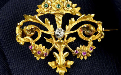 A French Art Nouveau 18ct gold old-cut diamond, emerald and ruby scrolling foliate brooch/pendant, with seed pearl drop.