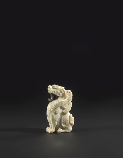 A GREYISH-WHITE JADE CARVING OF A MYTHICAL WINGED BEAST, MING DYNASTY, 17TH CENTURY