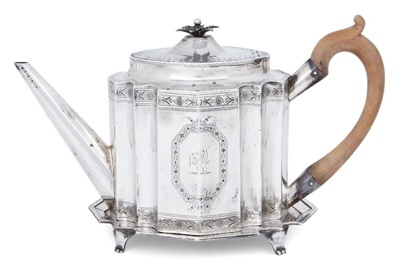 A George III silver teapot on an associated stand, the teapot London, 1788, Charles Hougham, the stand London, 1789, Elizabeth Jones, both of shaped oval form and decorated with bright cut engraving, with matching monograms, teapot 14.7cm high...