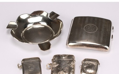 A George V silver rounded rectangular cigarette case, engine...