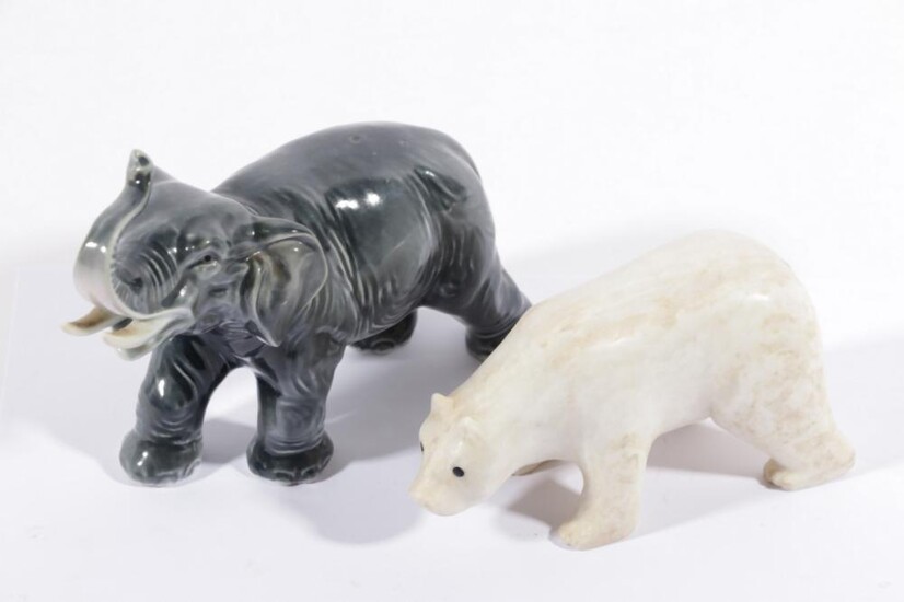 A German Porcelain Elephant figure together with a stone composite polar bear figure
