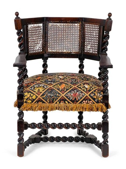 A Jacobean Style Carved Oak Cane Back Armchair Height