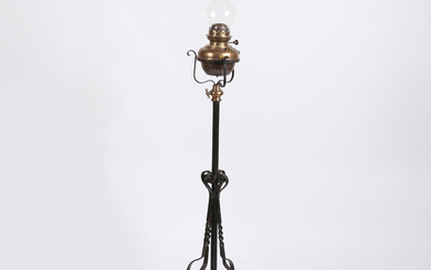 A LATE VICTORIAN BRASS AND WROUGHT IRON FLOOR STANDING OIL LAMP.