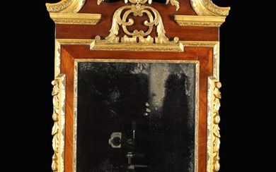 A Large George II Walnut & Parcel Gilt Wall Mirror. The rectangular glass in a shaped frame wi