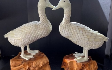 A MAGNIFICENT PAIR OR CARVED MARBLE GEESE