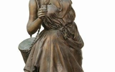 A MONUMENTAL BRONZE STATUE OF A YOUNG WOMAN