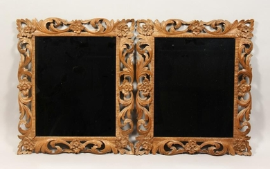 A PAIR OF 19TH CENTURY MIRRORS with leaf and flower