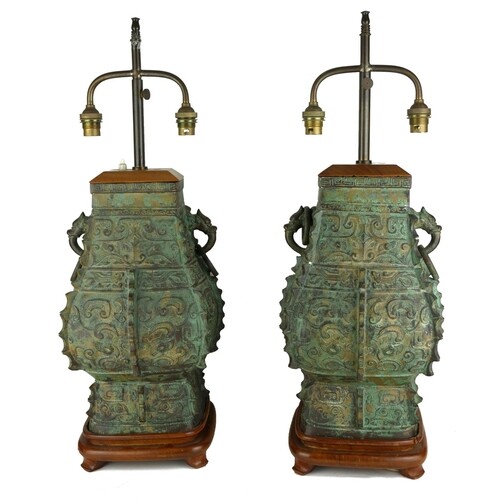 A PAIR OF CHINESE BRONZE ARCHAIC DESIGN VASES MOUNTED AS LAM...