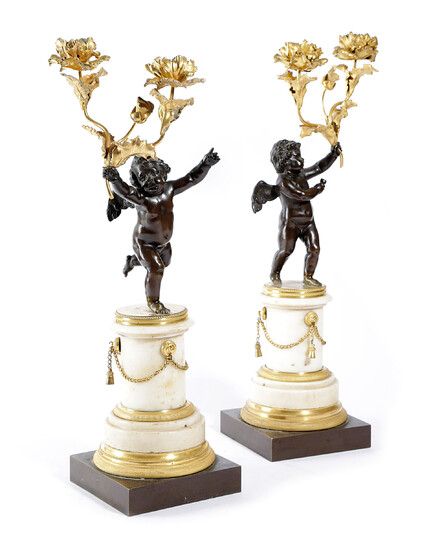 A PAIR OF GILT AND PATINATED BRONZE FIGURAL CANDELABRA