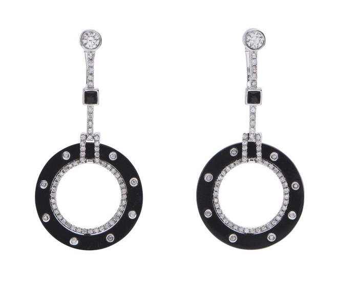 A PAIR OF ONYX AND DIAMOND EARRINGS