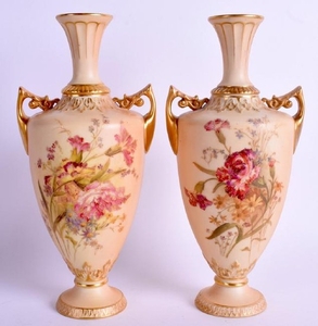 A PAIR OF ROYAL WORCESTER BLUSH IVORY TWIN HANDLED