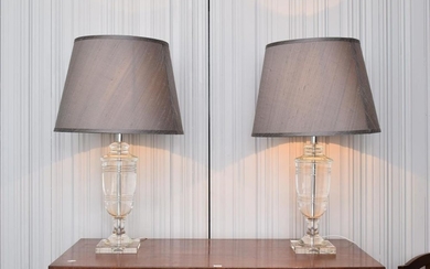 A PAIR OF SOLID CRYSTAL TABLE LAMPS WITH SHADES