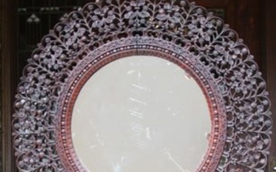 A PROFUSELY CARVED ANGLO INDIAN DRESSING MIRROR