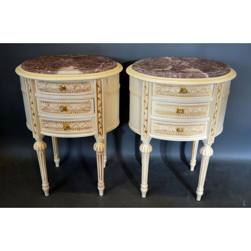 A Pair of French Cream Painted Oval Chests, the variegated m...