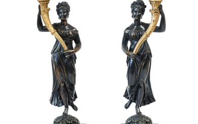 A Pair of Gilt and Patinated Bronze Figural Candlesticks, 2nd...