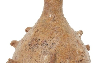 A Roman bottle with pinched projections, Eastern Mediterranean, circa 5th-6th century AD., the free-blown rounded body tapering to a short cylindrical neck. The body is decorated with a series of pinched projections, the base indented, the surface...