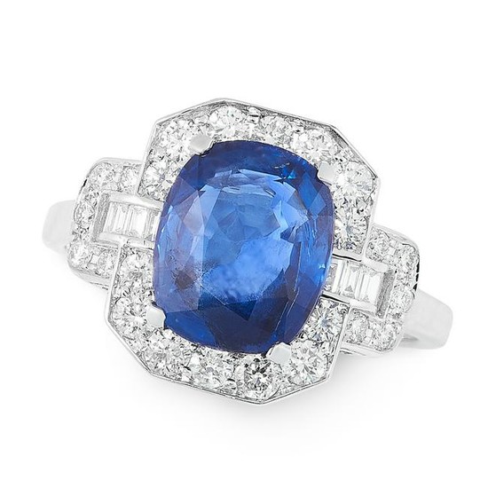 A SAPPHIRE AND DIAMOND CLUSTER RING set with a cushion