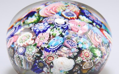 A SIGNED CLICHY CLOSE-PACKED MILLEFIORI PAPERWEIGHT