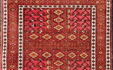 A SMALL WOOL RUG