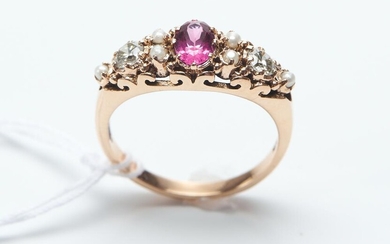 A SPINEL, DIAMOND AND SEED PEARL RING RING IN 9CT GOLD, FEATURING AN OVAL PINK SPINEL OF 0.65CT, SURROUNDED BY SEED PEARLS AND DIAMO...