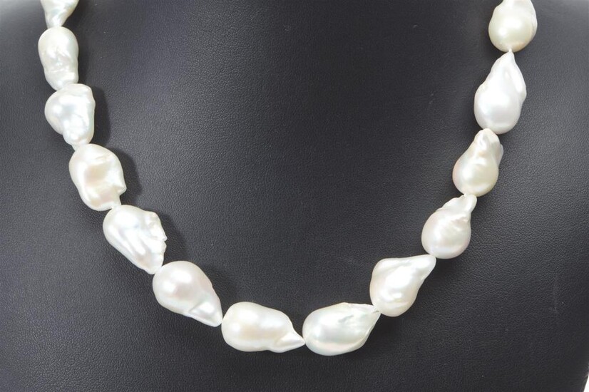 A STRAND OF LARGE BAROQUE FRESHWATER PEARLS BY REGAL, OF SILVER WHITE HUES WITH HIGH LUSTRE, TO A SILVER CLASP, TOTAL LENGTH 465MM,...