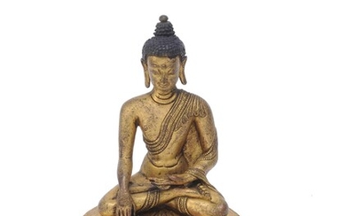 A Sino-Tibetan gilt-bronze figure of Buddha