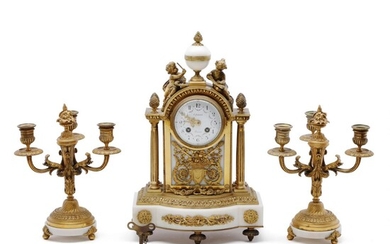 SOLD. A Swiss Louis XVI style gilt bronze and white marble three piece clock set. Late 19th century. Clock H. 42. B. 27. D. 16. Candelabre H. 28. (3) – Bruun Rasmussen Auctioneers of Fine Art