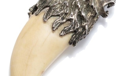 A VINTAGE SILVER AND IVORY LION PENDANT; tooth/claw shaped ivory applied with a silver lion head with mane, length 7cm, wt. 31.72g.