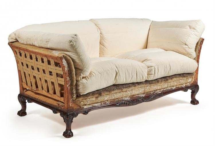 A Victorian carved mahogany sofa by HOWARD & SONS, second half 19th century