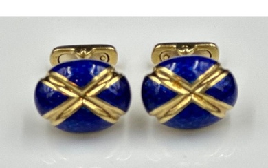A beautiful pair of 18ct gold and blue enamel cuff links wit...