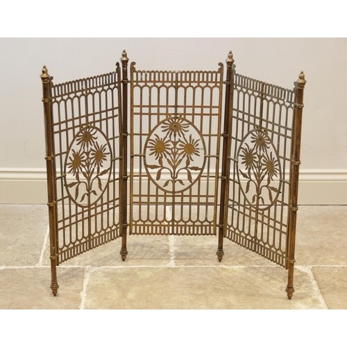 A brass floral three panel fire screen, 20th century, each p...