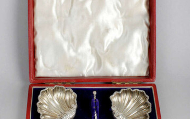 A cased set of late Victorian silver shell salts, plus a cased pair of Edwardian silver salts.