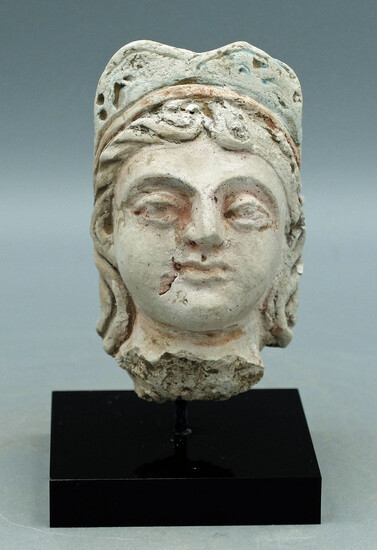 A choice Gandharan stucco head of a woman