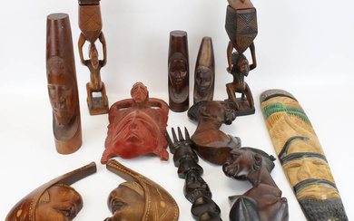 A collection of assorted carved African tribal items. Including ornaments, masks, etc. Max.