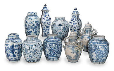 A collection of blue and white vases and covers