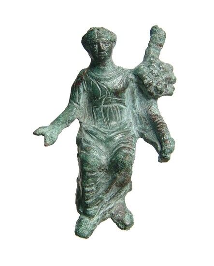 A detailed Roman bronze figure of seated Genius