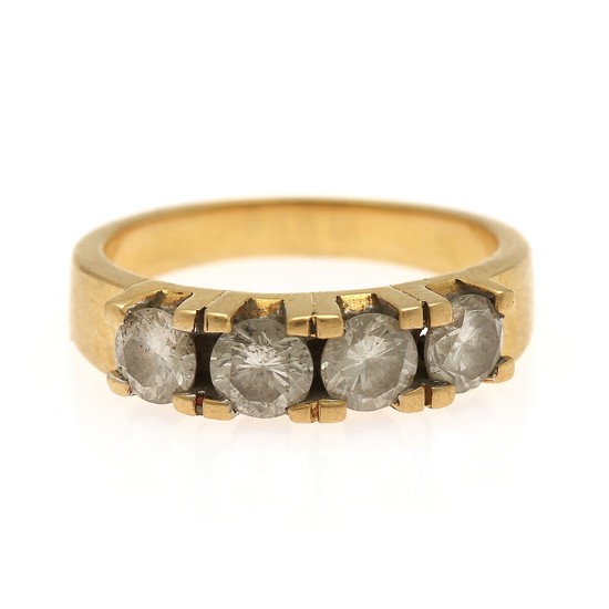 A diamond eternity ring set with four brilliant-cut diamonds, mounted in 18k gold. Size 55.
